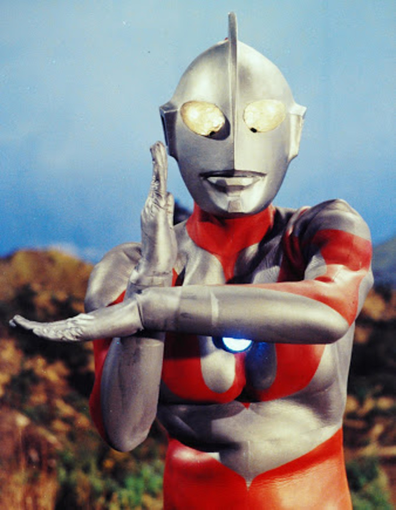 ultraman is a cool red and silver japanese superhero who beats