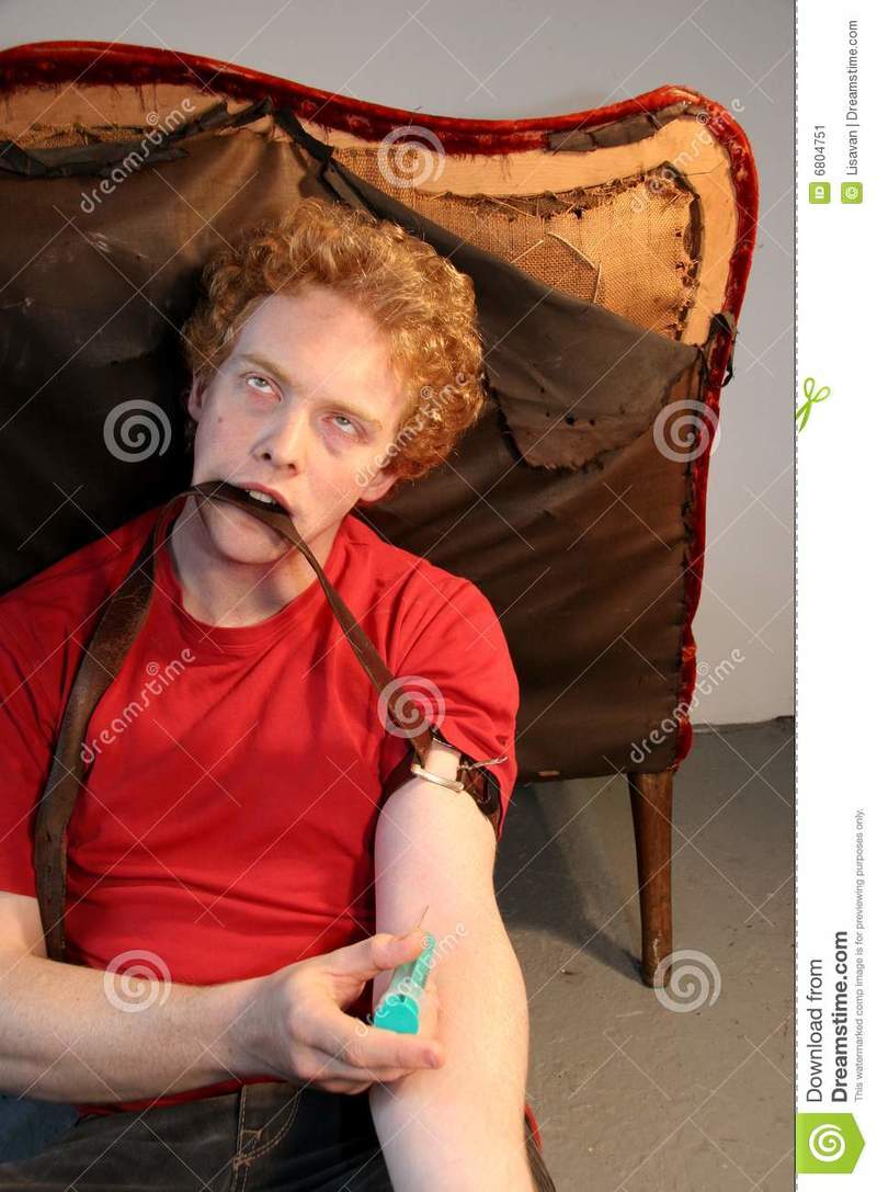 What is the meaning of "junkie. give me an example!"? Question about